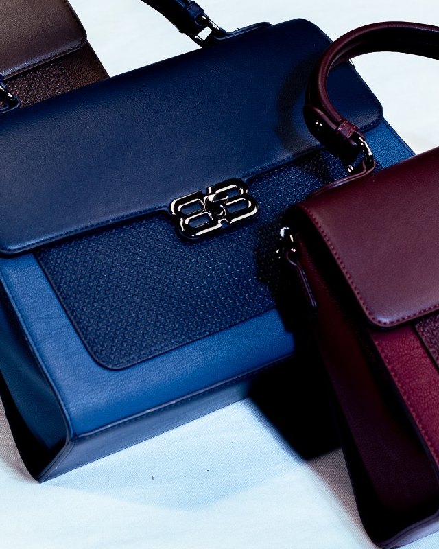 Close detail of the Bibi BX woven-textured panel and gold clasp.